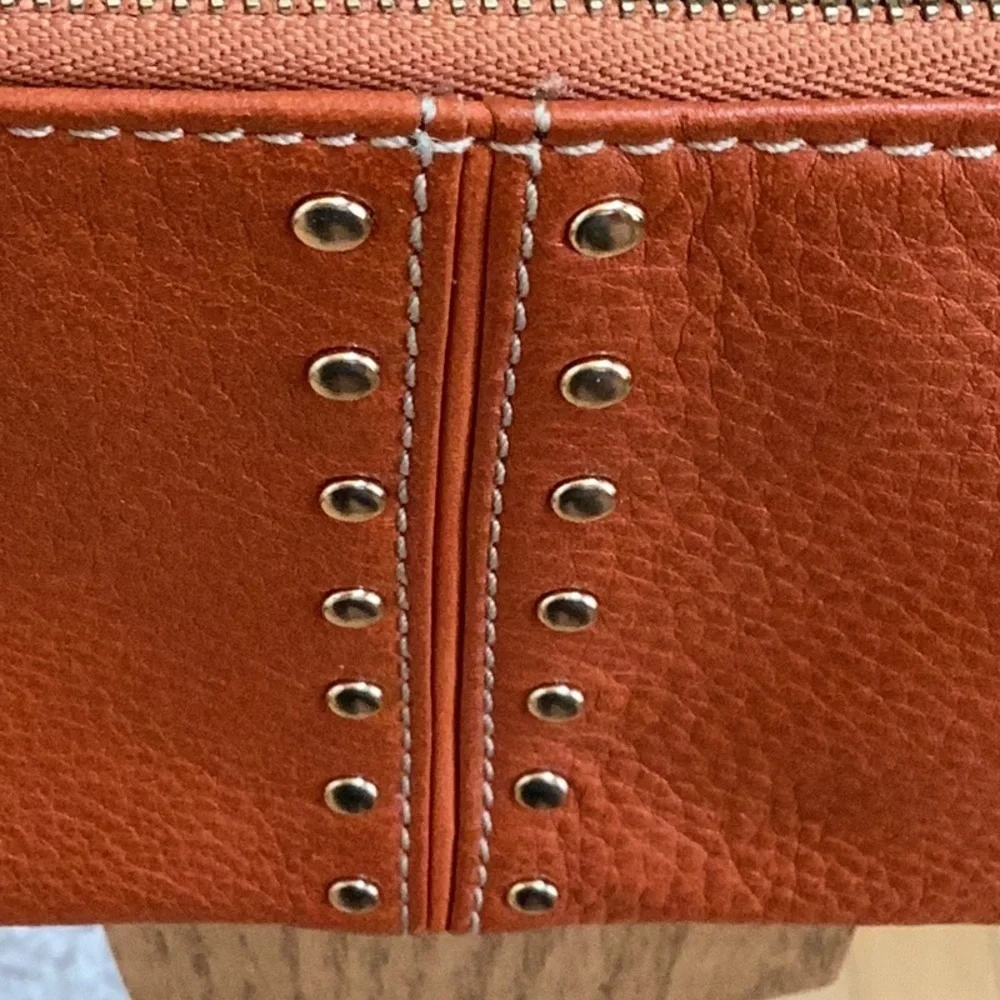 Michael Kors orange, gold tone Studded wristlet, clutch, zipper pouch